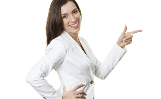 Confident businesswoman gesturing on white